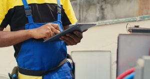 Technician fixing refrigerant issues
