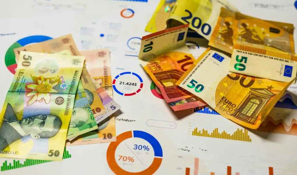 Dinheiro de diversas denominações europeias sobre gráficos de investimentos destacando a importância da diversificação nos investimentos.