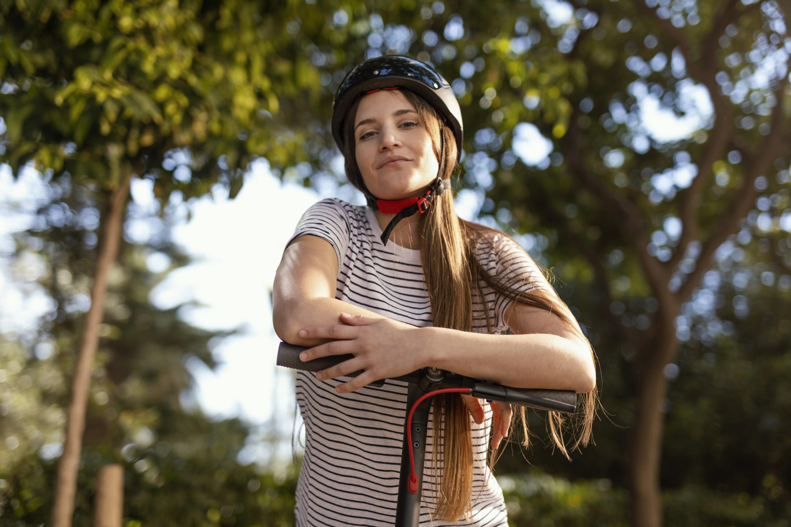 young-woman-rides-electrical-scooter-park